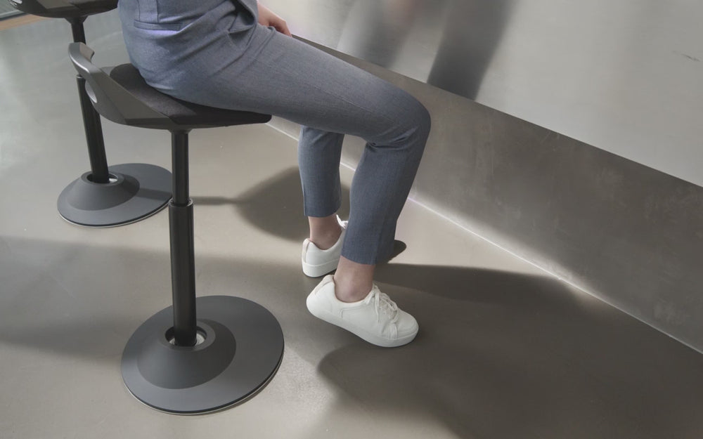 This video shows how people use the Aeris Muvman sit-to-stand stool in a half-sitting and half-standing position.